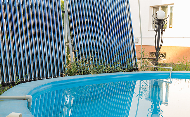 solar collectors on ground by pool