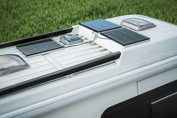 Class A RV with solar panels mounted on the roof.